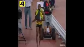 Usain Bolt fall - Chinese Cameraman falls on Usain Bolt after men's 200 meter final