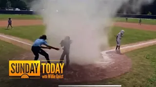 Umpire rescues 7-year-old baseball player from dust devil on field