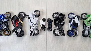 • ON THE FLOOR SOME DIFFERENT MINIATURE MOTORCYCLES