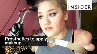 Quadruple amputee uses prosthetics to apply makeup