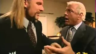 Triple H and Ric Flair discussing Batista before the contract signing for Wrestlemania 21