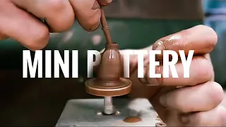 Throwing miniature pot on DIY pottery wheel. Satisfying video of making tiny bottle from clay.