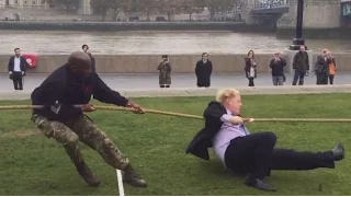 Boris Johnson falls over during tug of war