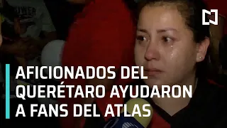 Aficionados del Querétaro protegieron a seguidores del Atlas - Las Noticias