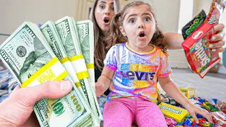 3 Year old Picks Between Money & Candy!