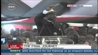 Raila Odinga performs a song to praise the Late Otieno Kajwang