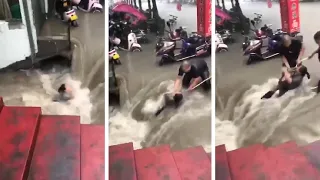 China flooding: Woman rescued from submerged subway