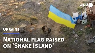 Ukrainian troops raise national flag on Snake Island in Black Sea | AFP