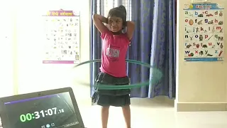 LONGEST TIME TO SPIN HULA HOOP AROUND WAIST BY A KID