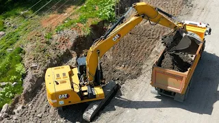 Cat 330 GC excavator next to electrical wires