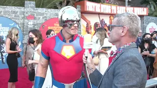 Margot Robbie Photobombs John Cena at The Suicide Squad Premiere