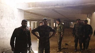 Syrian government forces find rebel weapons stockpile near Damascus