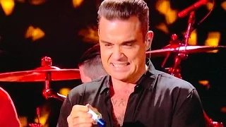 Robbie Williams Disinfects Hands After Touching Dirty Audience NYE 2016 Coronovirus Sanitiser