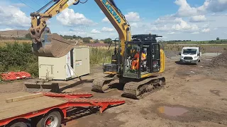 Loading excavator on to trailer