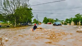 Flash Flood Emergency Clearing a Clogged Street Drain