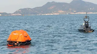 M75  Unmanned Surface Vehicle Rescuing Troubled Swimmer On Sea