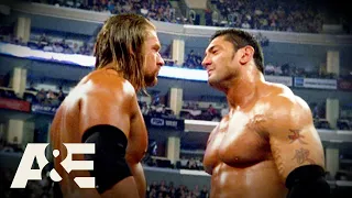 Batista BETRAYS Triple H Leading to EPIC Rivalry | WWE Rivals | A&E