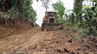 Caterpillar D6R XL bulldozer operator is doing a great job laying new roads on plantations
