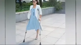 The beautiful woman has an amputated leg and walks with crutches #amputee