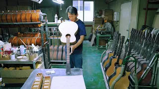 Process Of Making Acoustic Guitar. An elderly couple who have been making guitars for 40 years