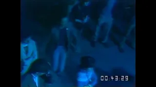 guy in the audience vibing at a new order concert in 1981