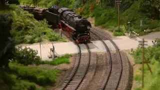 Steam Locomotive and Trains on a Model Railway Layout in HO Scale