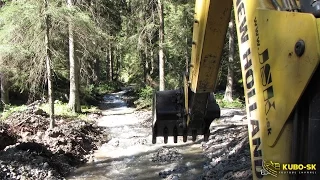 New Holland LB 115.B - backhoe digging gravel