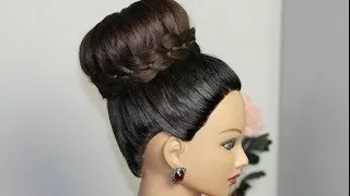 Braided bun updo. Hairstyle for long hair.