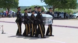 Thousands line streets as Dallas policemen laid to rest