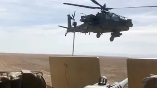 Slow Mo Footage of Apache Gunship Buzzing US Convoy In Syria