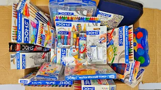 Box full of doms stationery - brush pens, wax crayons, colour pencils, retractable eraser, sharpner