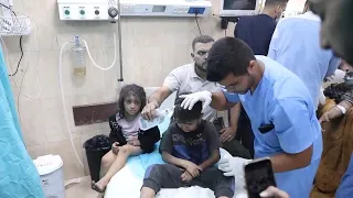 Injured from strike on Nuseirat camp in Gaza arrive in crowded Deir al-Balah hospital