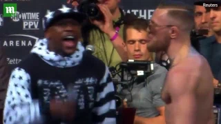 Mayweather attempts to embarrass McGregor by throwing money