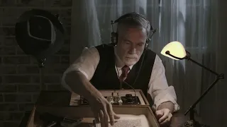 WWII spy opens a suitcase to reveal a wireless transmitter which he uses to transmit intel. ASMR