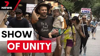 Thousands of Queenslanders rally for more action to stop violence against women | 7 News Australia