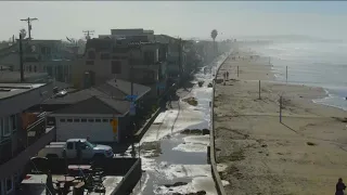 Rushing waves flood coastal areas of San Diego County after a powerful storm drenched California