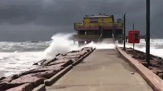 Waves and wind in Galveston as Hurricane Laura churns 235 miles away