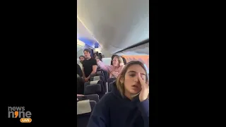 Israelis in an airplane as Hatikvah Israel’s national anthem plays