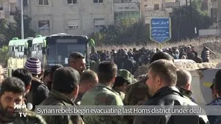 Syria rebels begin evacuating last Homs district under deal