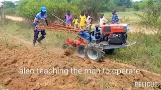 walking tractor in Uganda, long handle's teaching on how to operate.+254705372274