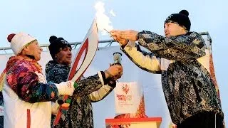 Olympic flame arrives in Russian town where Greenpeace activists held