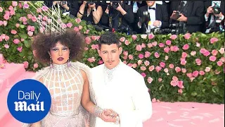 Nick Jonas holds onto wife Priyanka Chopra at the 2019 Met Gala