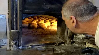 Bread cooked in a wood oven since 1920 - The magic of the night in an ancient oven Bakery - Italy