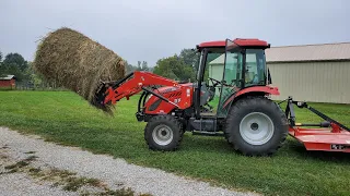 Rural King RK55 unloading hay