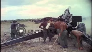 Soldiers fire the 155mm Howitzer for testing and examine it during the Vietnam Wa...HD Stock Footage