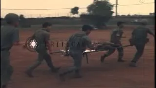 A wounded Vietnamese soldier is transferred from Fire Support Base Lima to an ARV...HD Stock Footage