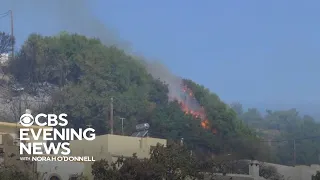 Wildfires burn through Greece's popular vacation island Rhodes