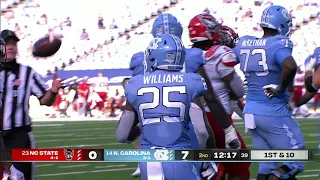 Javonte Williams runs over NC State