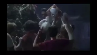 Pennywise high-fiving the losers club before battle