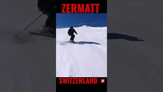 Ex-ski racer carving short turns on Furg red slope in Zermatt Switzerland.